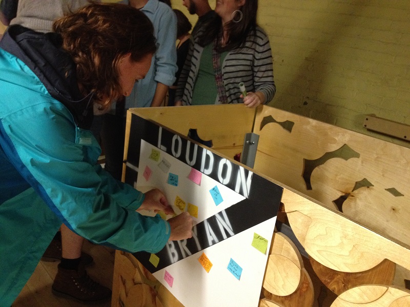 A kind woman adds her sentiments to the maptimeLEX participatory Night Market map